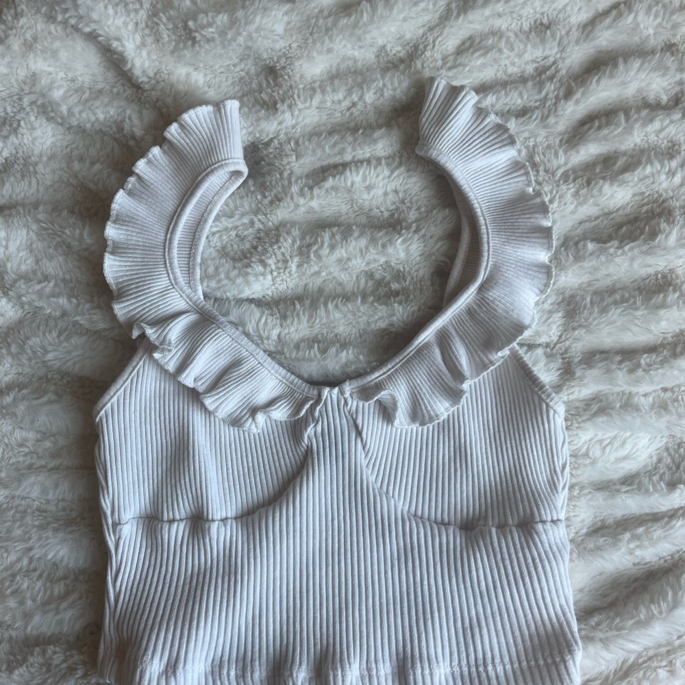 White ruffled top